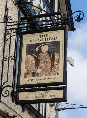The sign for The Kings Head public house, Warrington, Cheshire, on the exterior of a mock tudor buildingのeditorial素材