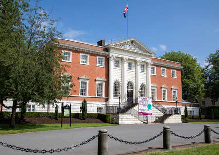 The front of Warrington Hall located in Bank Park Warrington Cheshire with the Union Flag flying May...