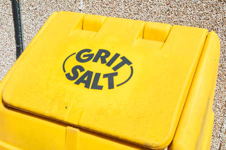 A yellow bin for grit and salt for winter weather Wrexham Wales June 2018の写真素材