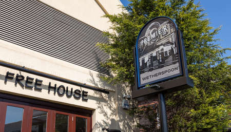 Exterior of the Premier public house including sign in Widnes town centre April 2019