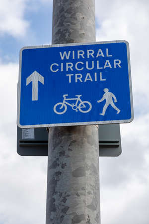 blue and white sign indicating wirral circular trial for cyclists and pedestrians in new brighton...
