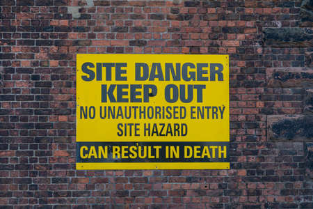 Sign warning of danger on a derelict building inBirkenhead Wirral August 2019のeditorial素材