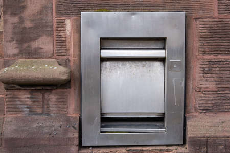 Disused bank deposit box outside building inBirkenhead Wirral January 2020