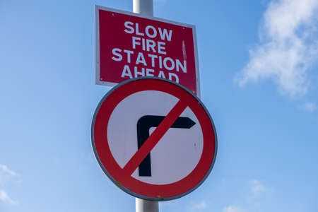signs warning of fire station ahead  and no right turn inSaughall Massie February 2020の写真素材