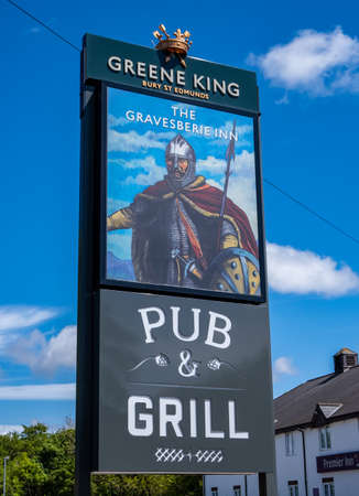 Sign outside The Gravesberie Inn public house in Greasby Wirral May 2020のeditorial素材