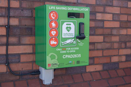 Wall mounted defibrillator at the train station Bolton Lancashire July 2020