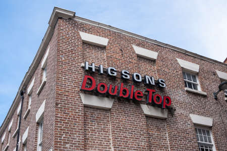 Old Higsons Double Top sign on building above shop in Liverpool July 2020