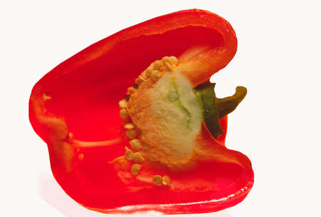 Slice of cut red salad pepper on  white backgroundの写真素材