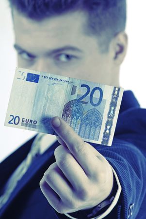 businessman holds in hand monetary denomination 20 euros and looks in an objective の写真素材