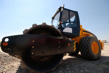 steam-roller on  background of  dark blue skyの写真素材