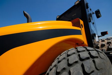 steam-roller on  background of  dark blue sky, close-up