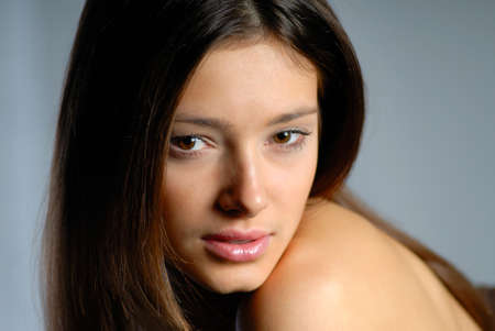 portrait of  young woman on  dark backgroundの写真素材