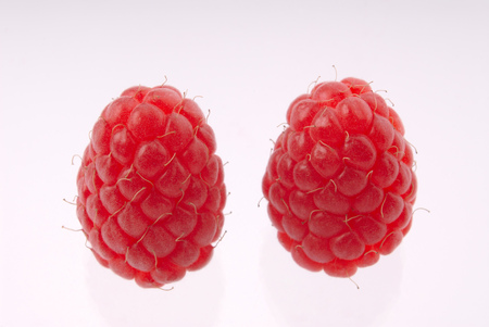 crop red raspberries,  close up