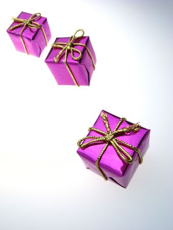 usual gift boxes of violet color on  white backgroundの写真素材