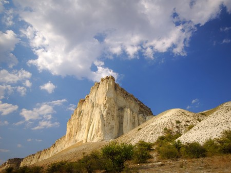 old mountains and clouds in blue skyの写真素材