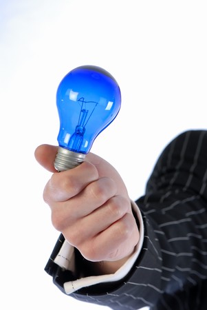 hand businessman with lamp of dark blue color on white backgroundの写真素材