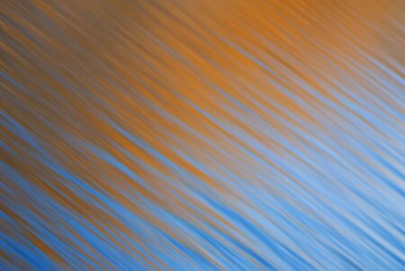 Composition from rhythmical waves on  surface of water of bright yellow and blue colorの写真素材