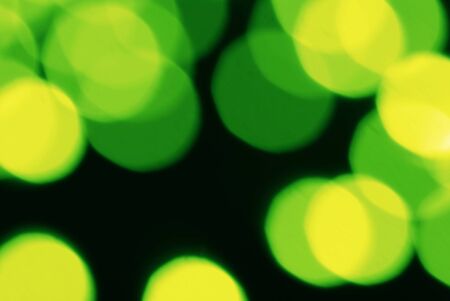 Composition of light spots of electric lamps of bright yellow green colorの写真素材
