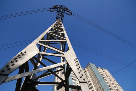 Column, support, transmission line on  background of  blue sky