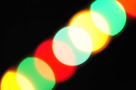 Bright and contrast, yellow, green, red, ??????? a stain on a black backgroundの写真素材