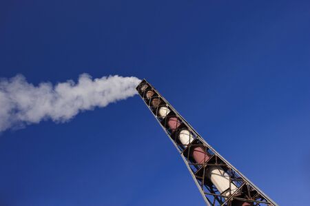 Emission of the fulfilled gases in atmosphere through a pipe, a mining industryの写真素材
