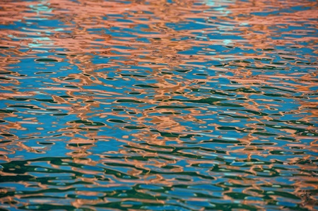 Reflection on a surface of sea water, in a bright sunny day 