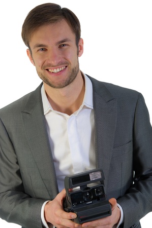 cheerful nice photographer with the camera in hands photographsの写真素材