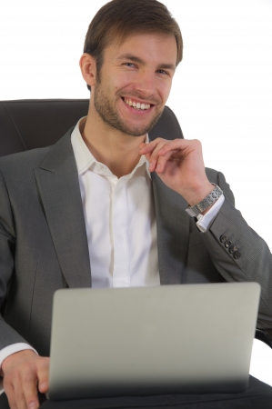 nice businessman works sitting in a chair with the open laptopの写真素材