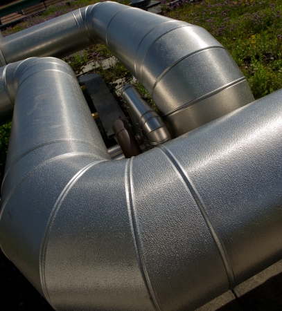 ventilating an air duct on a construction roof in a sunny dayの写真素材