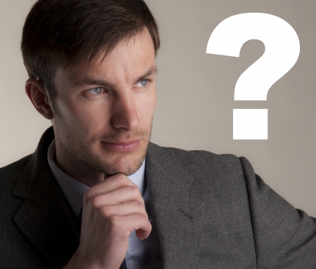serious businessman thought of a questionの写真素材
