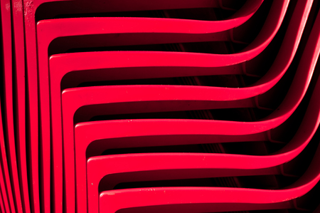 rhythmically lined plastic products, illuminated by sunlightの写真素材