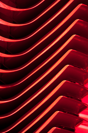 rhythmically lined plastic products, illuminated by sunlightの写真素材