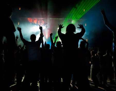 A crowd of people relaxing and having fun in a discoの写真素材