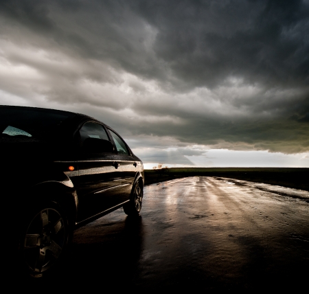 car on wet asphalt road after rainの写真素材