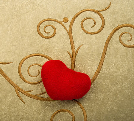 Valentines Day background with heart on golden backgroundの写真素材