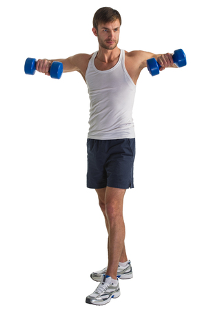 male athlete doing exercise with dumbbells in handの写真素材