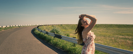 A woman stands at the road  Portrait of a girl  Beautiful girl  の写真素材