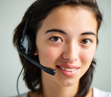 Call center operator businesswoman with laptop computer, closeupの写真素材