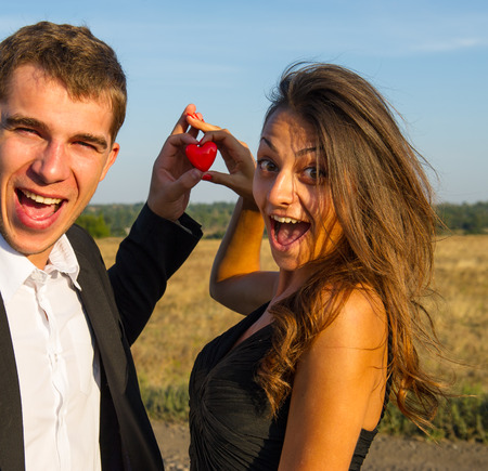 pair of lovers young people holding a heartの写真素材