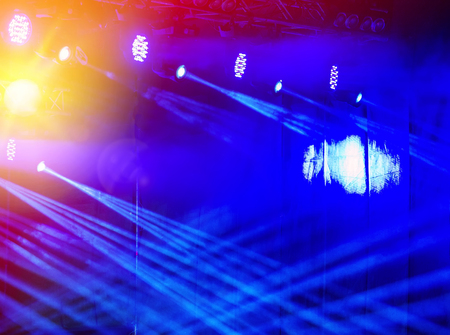 bright stage lights on a dark backgroundの写真素材
