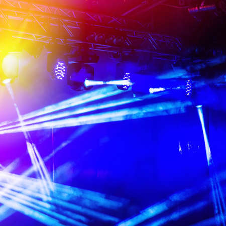 bright stage lights on a dark backgroundの写真素材