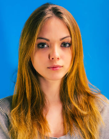 young beautiful woman looking at the cameraの写真素材