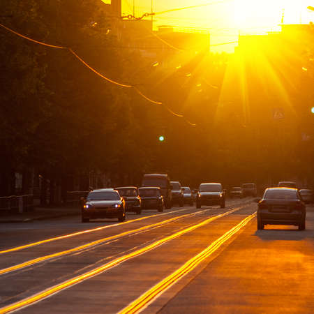 city streets and cars at sunset, summer seasonの写真素材