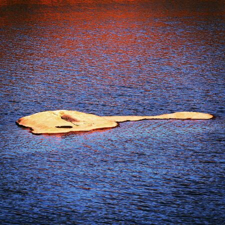 granite stone surface waves water riverの写真素材