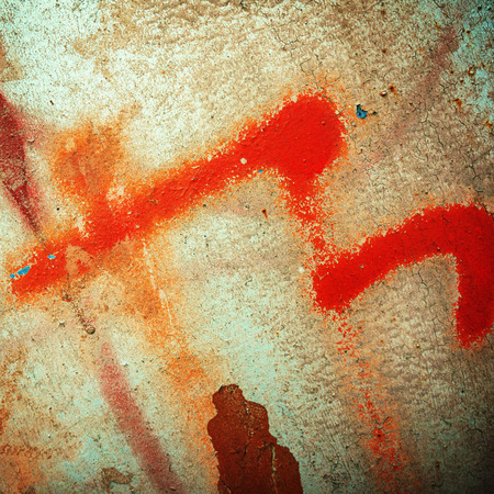 surface of the metal sheet covered with old paint and rustの写真素材