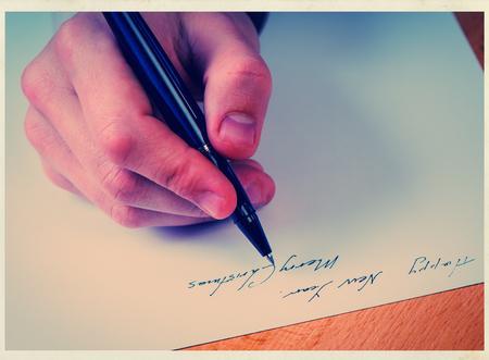 businessman hand with penの写真素材