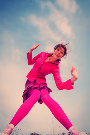 portrait of a girl with her hair against the skyの写真素材