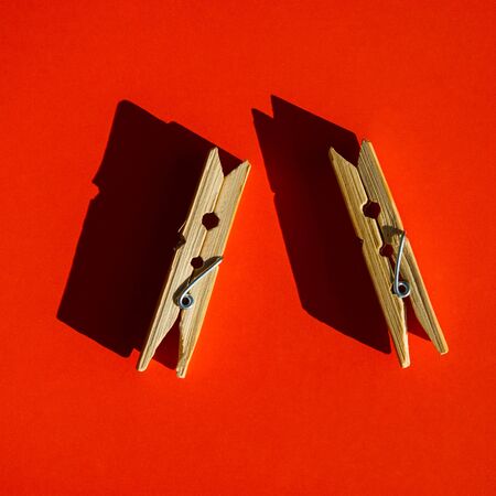 pair of pegs is on an orange backgroundの写真素材