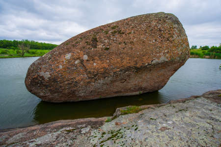 granite stones flowering plants on the riverの写真素材