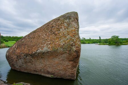 granite stones flowering plants on the riverの写真素材